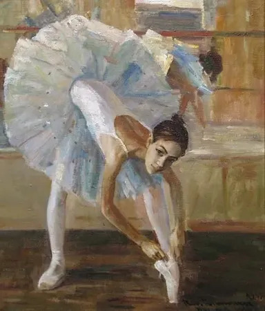 Young Ballerina Tying Her Point Shoes